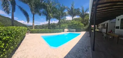 a swimming pool in the backyard of a house at ENTREPALMAS in San Jerónimo