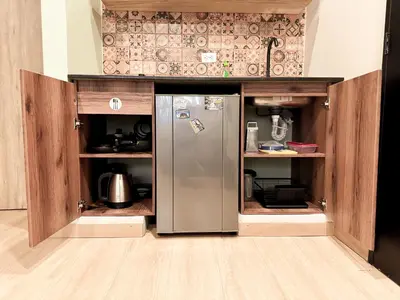 an open kitchen with a stainless steel refrigerator at Apartamento amoblado asiste a Guns N Roses NID201 By Roots Rentals in Medellín