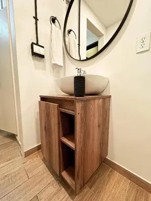 a bathroom with a sink and a mirror at Apartamento amoblado asiste a Guns N Roses NID201 By Roots Rentals in Medellín