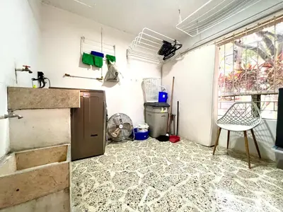 a kitchen with a refrigerator and a table and a window at Apartamento amoblado asiste a Guns N Roses NID201 By Roots Rentals in Medellín