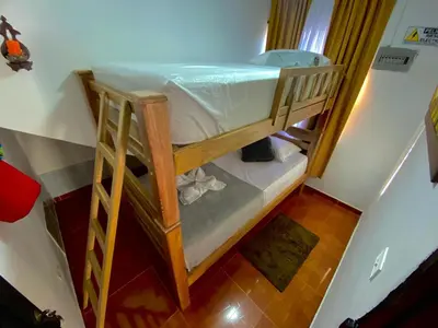 an overhead view of a bunk bed in a room at Noches de Guatapulco in Guatapé