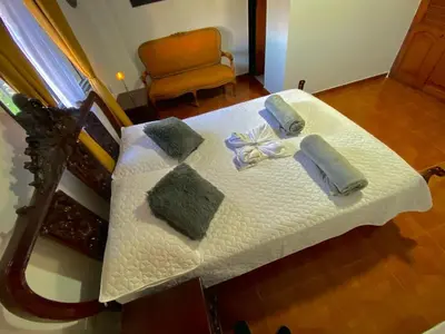 a white table with towels and napkins on it at Noches de Guatapulco in Guatapé