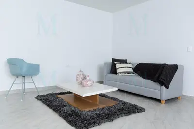 a living room with a couch and a table at La Casa de Ana 2 in Jardin