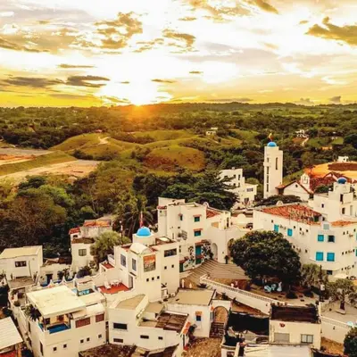 an aerial view of a town with white buildings at El Santorini colombiano in Puerto Triunfo