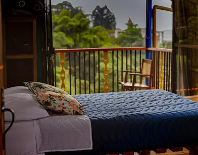 a bed with a pillow on a porch at Jaibaná Spa in Támesis