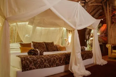 a bedroom with a bed with a canopy at Bethel Lozana Guatape in Guatapé