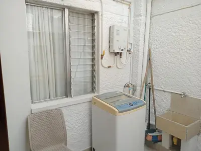 a trash can in a room with a window at Estadio APARTE HOTEL 203 in Medellín
