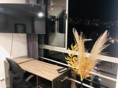 a room with a desk and a window with a view at 1009 Apartamento zona exclusiva Poblado in Medellín