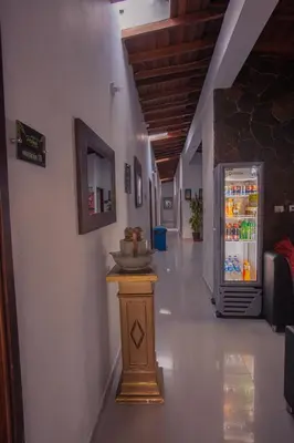 an empty hallway with a refrigerator in a building at Hotel Palma De Sevilla Medellin in Medellín
