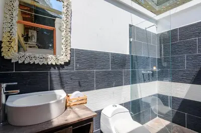a bathroom with a sink and a mirror at Finca Hotel Guadalupe in Santa Fe de Antioquia