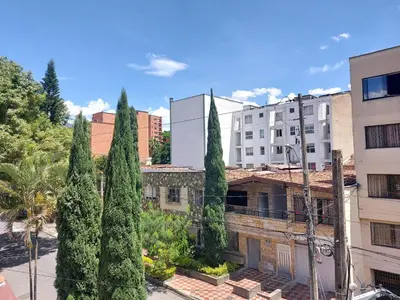 a view of a city with trees and buildings at Apartamento Laureles la 33 in Medellín