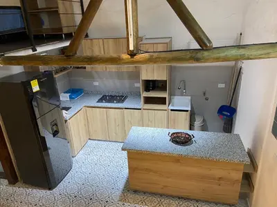 an overhead view of a small kitchen with a counter at Las 4 Estaciones Alojamientos de Ensueño Santorini Doradal in Puerto Triunfo