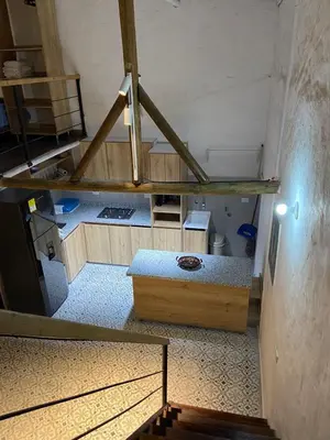 an overhead view of a room with a bed and stairs at Las 4 Estaciones Alojamientos de Ensueño Santorini Doradal in Puerto Triunfo