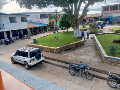 an aerial view of a car parked next to a motorcycle at Hotel El Balcon de madera in Norcasia