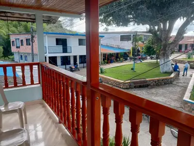 a balcony with a view of a street at Hotel El Balcon de madera in Norcasia