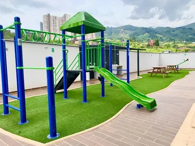 a playground on the roof of a building with a slide at CE20 Excepcional Apartamento Piscina y parqueadero in Sabaneta