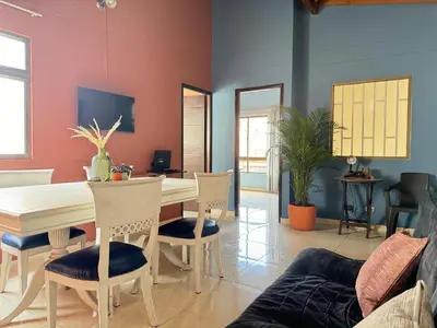 a dining room with a table and chairs at Apartamento Relax in Medellín