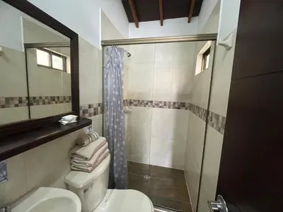 a bathroom with a toilet and a shower at Apartamento Relax in Medellín