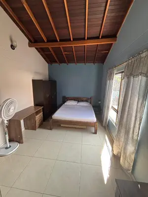 a bedroom with a bed and a wooden ceiling at Apartamento Relax in Medellín
