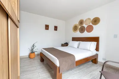 a bedroom with a bed in a room at Hotel Prada in Bello