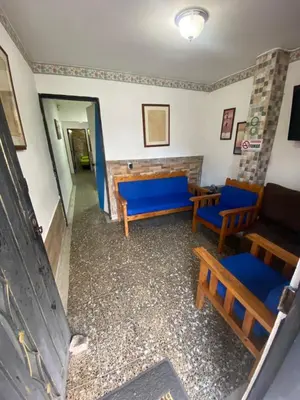 a room with blue benches and a couch at Apartamento con Vista y acceso al lago en Guatape in Guatapé