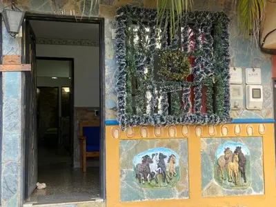 a wall with a painting of animals on it at Apartamento con Vista y acceso al lago en Guatape in Guatapé