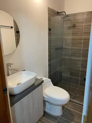 a bathroom with a toilet and a sink and a shower at Cozy house en envigado con Jacuzzi in Envigado