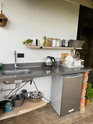 a kitchen counter with a sink and some pots and pans at Montecafé Jardín in Jardin