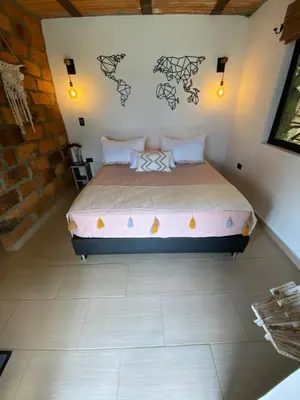 a bedroom with a bed in a room at Montecafé Jardín in Jardin
