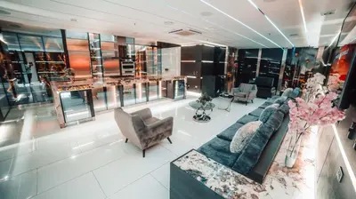 a living room with a couch and a chair at 1Million Luxury Suites in Medellín