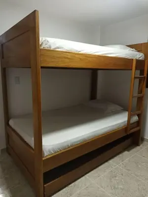 a couple of bunk beds in a room at Linda casa con espectacular vista embalse y piedra in Guatapé