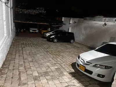 a group of cars parked in a garage at Aparta Suite Torre De Prado 302 in Medellín