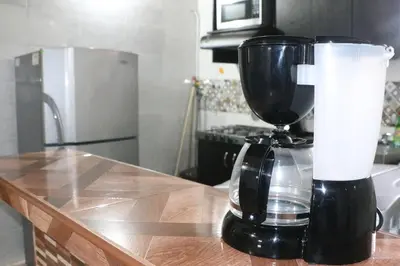 a black blender sitting on top of a counter at Aparta Suite Torre De Prado 503 in Medellín
