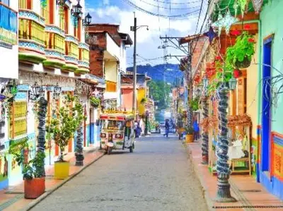 a painting of a city street with a trolley at Aparta Suite Torre De Prado 503 in Medellín