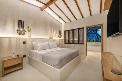 a bedroom with a large bed in a room at Provenza 6 Bedroom House by HOUSY HOST in Medellín