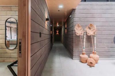 a hallway with two baskets on the wall at Hotel Living by Armoniko in Medellín