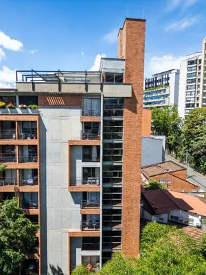 an apartment building with a chimney on top of it at Flat Apartamento Great Location Poblado in Medellín
