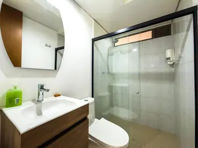 a bathroom with a toilet and a sink and a shower at Flat Apartamento Great Location Poblado in Medellín