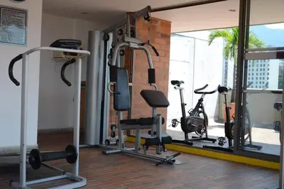 a gym with several treadmills and exercise bikes at Flat Apartamento Great Location Poblado in Medellín