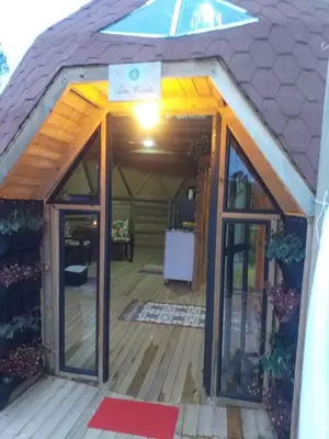 an outside view of a tiny house with a porch at Unique Glamping / Domo Betsaida in Guatapé
