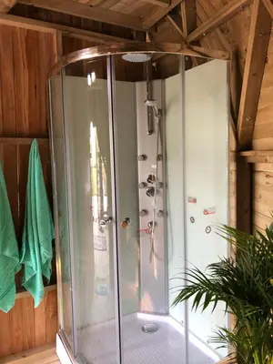a shower with a glass enclosure in a room at Unique Glamping / Domo Betsaida in Guatapé