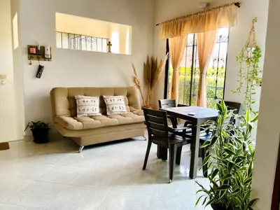 a living room with a couch and a table at Apartamento de Descanso - Doradal in Doradal
