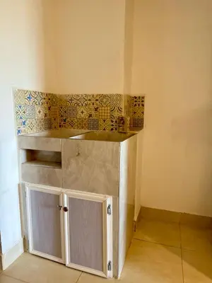 a small kitchen with a counter in a room at Apartamento de Descanso - Doradal in Doradal