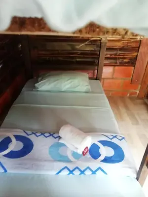 a room with two bunk beds with a towel at Cabañas orquídea in Norcasia