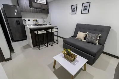 a living room with a couch and a table at Casa García Rent Home in Guatapé
