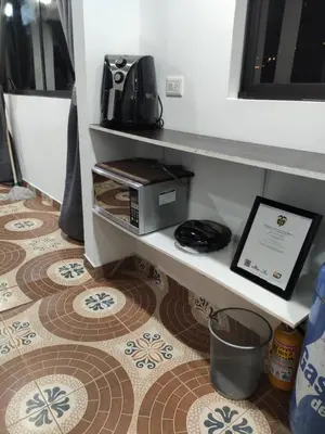 a room with a counter with a table on a floor at Hermoso apto con excelente vista in Bello