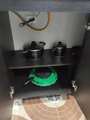 a kitchen with two pots and pans on a stove at Hermoso apto con excelente vista in Bello