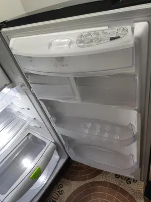 an open refrigerator with its door open and its at Hermoso apto con excelente vista in Bello