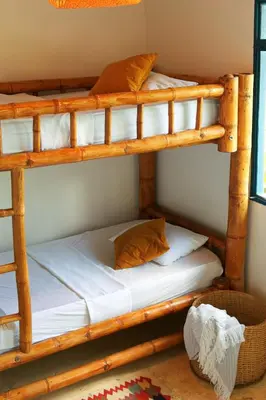 a bedroom with two bunk beds in a room at Casa Mostaza-Ecolodge in Samaná