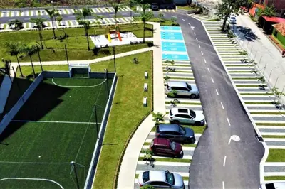 an aerial view of a parking lot with a tennis court at Acogedor, Gran Vista a las Montañas y a la Ciudad! in Santa Fe de Antioquia